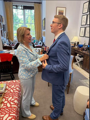A mom always feels the need to straighten a young man’s tie